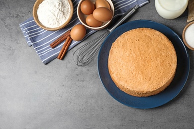 Flat lay composition with delicious fresh homemade cake on grey marble table