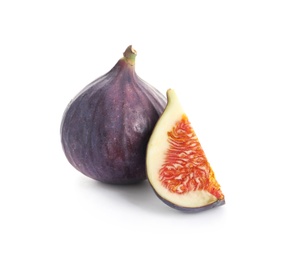 Whole and cut purple figs on white background