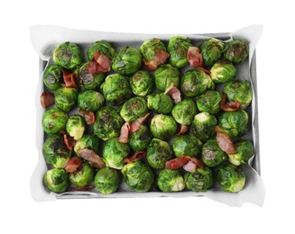 Delicious roasted Brussels sprouts and bacon in baking dish isolated on white, top view