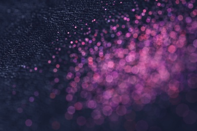 Photo of Magic pink bokeh effect on dark background