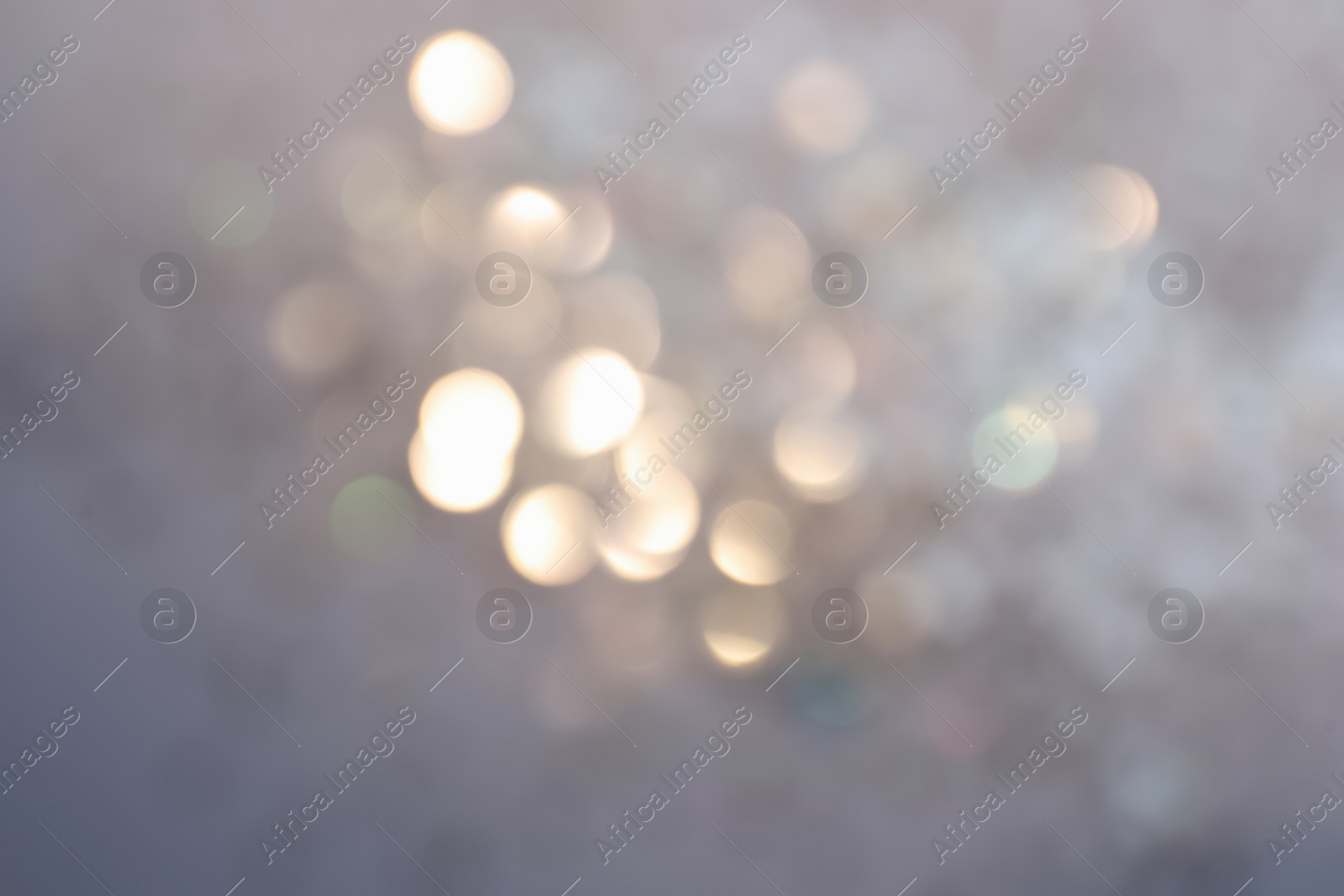 Photo of Shiny lilac background with magical bokeh effect