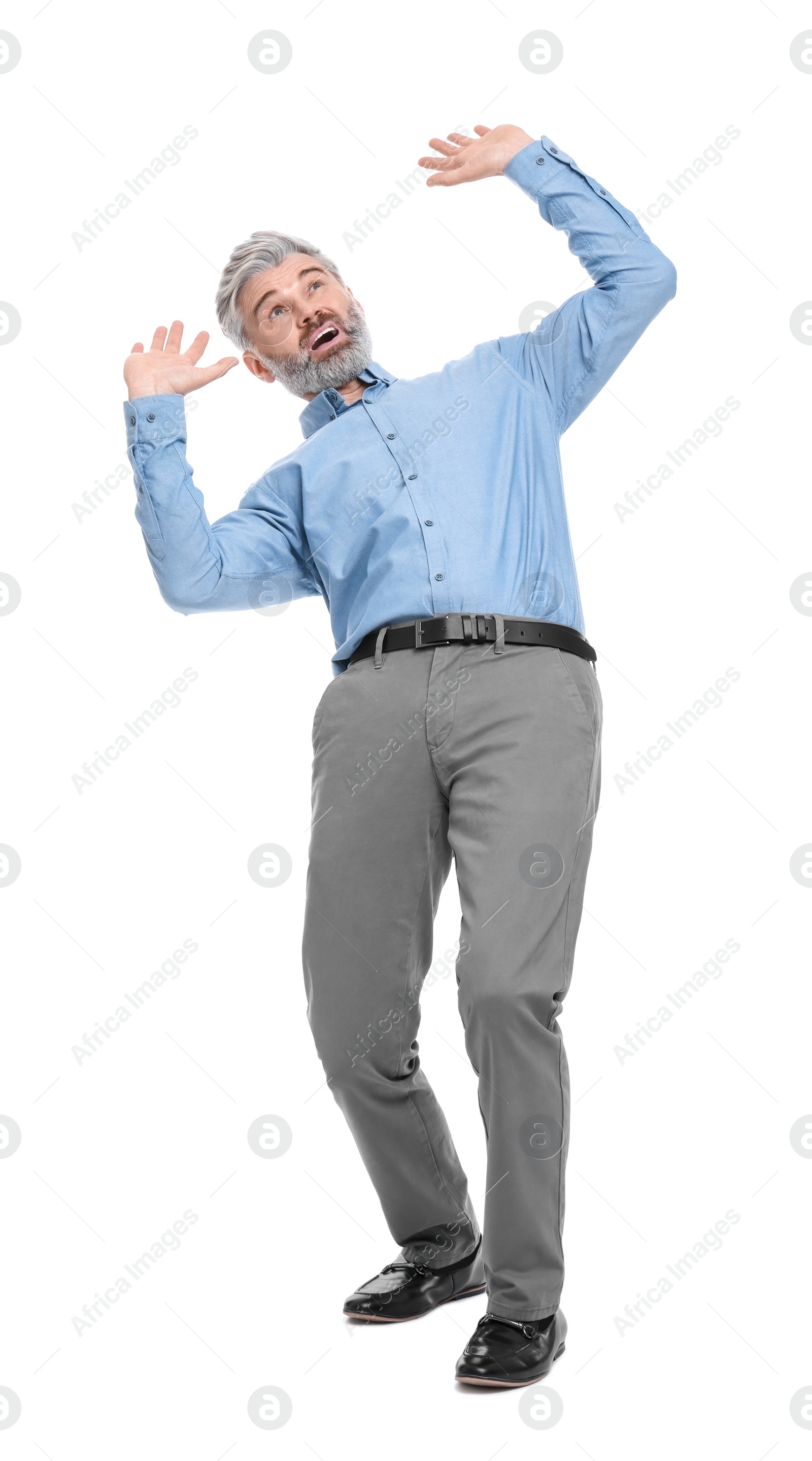 Photo of Mature businessman in stylish clothes avoiding something on white background