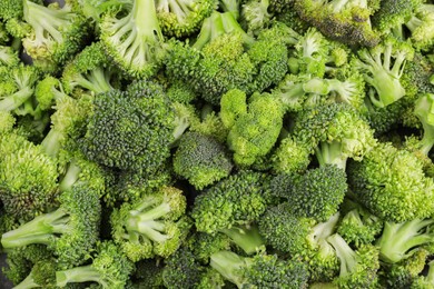 Photo of Fresh raw broccoli as background, top view