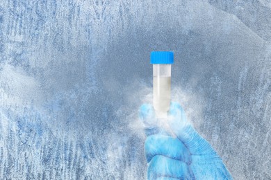 Image of Cryopreservation. Laboratory assistant holding container with sperm, closeup and space for text. Frost effect