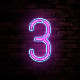 Image of Glowing neon number 3 sign on brick wall