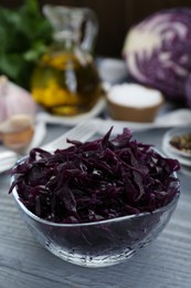 Photo of Tasty red cabbage sauerkraut on light grey wooden table