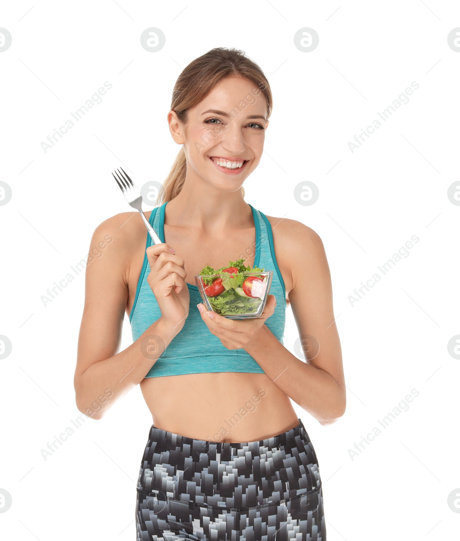 Photo of Happy slim woman in sportswear with salad on white background. Weight loss diet