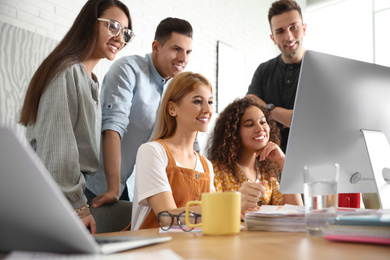 Photo of Team of professional designers working in office