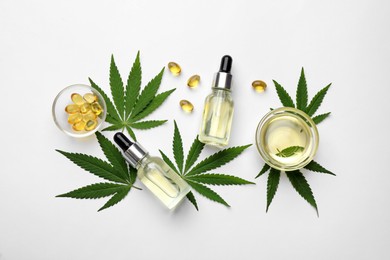 Photo of Flat lay composition with hemp leaves, CBD oil and THC tincture on white background