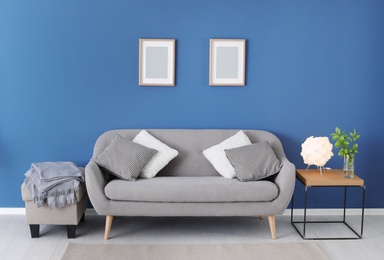 Photo of Stylish living room interior with comfortable sofa
