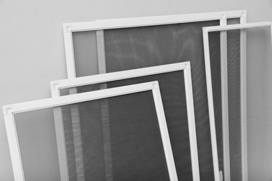 Photo of Set of window screens on light grey background