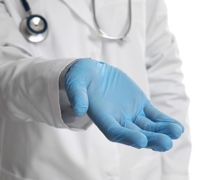 Photo of Doctor wearing light blue medical glove holding something on white background, closeup