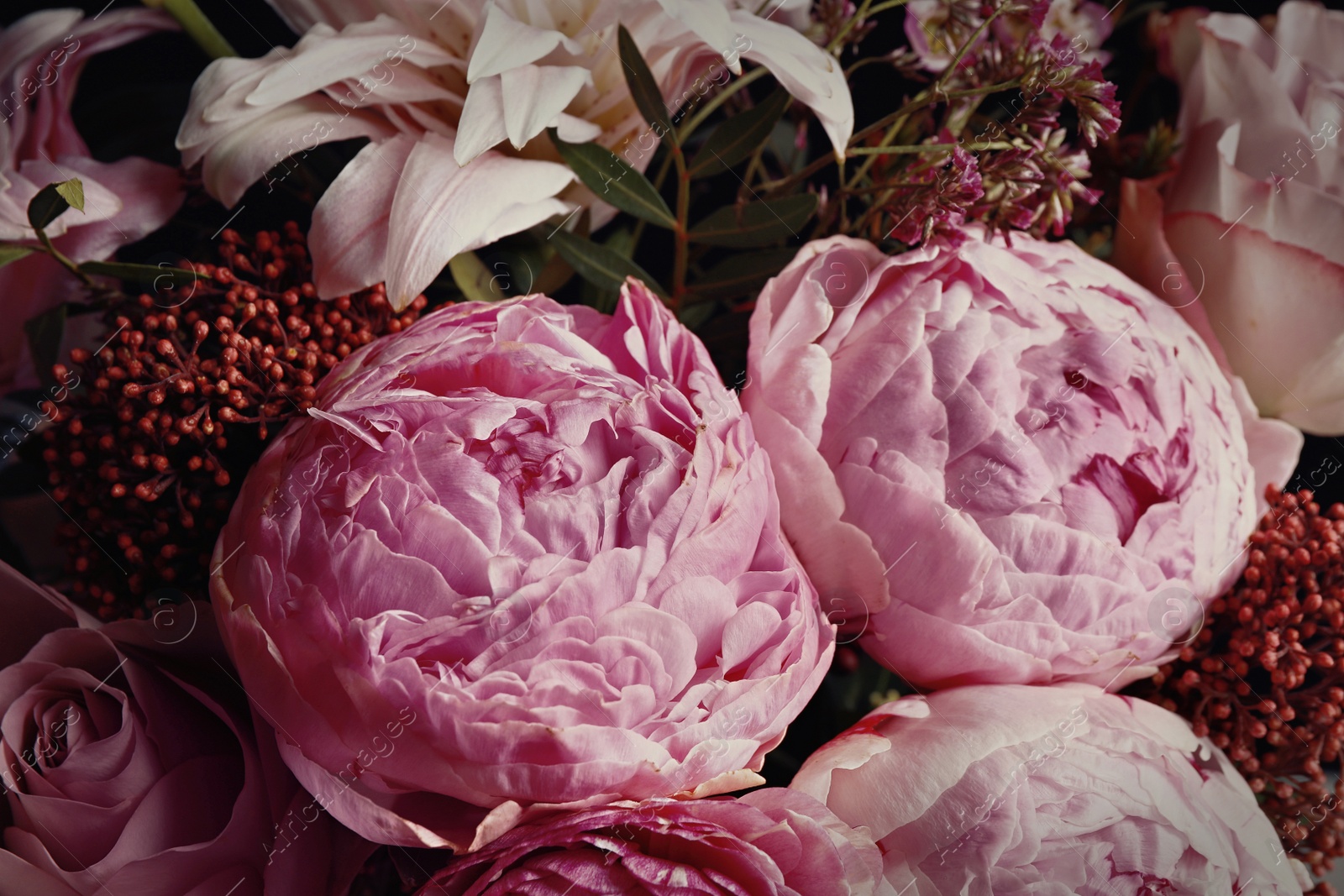 Photo of Beautiful bouquet of different flowers, closeup. Floral card design with dark vintage effect