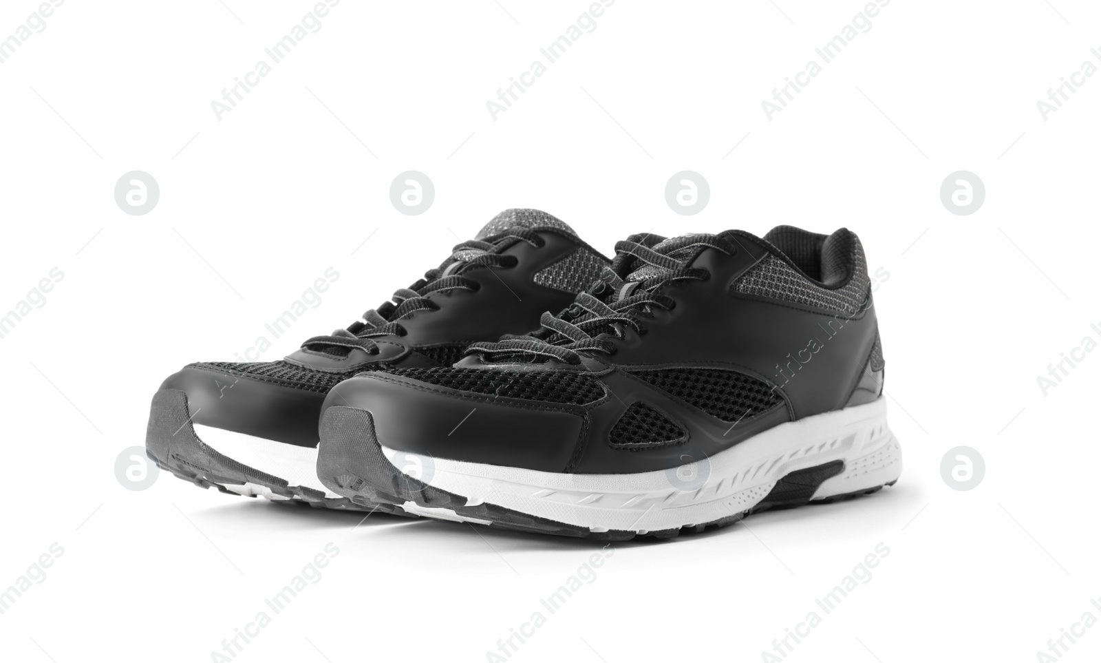 Photo of Stylish sport shoes on white background. Trendy footwear