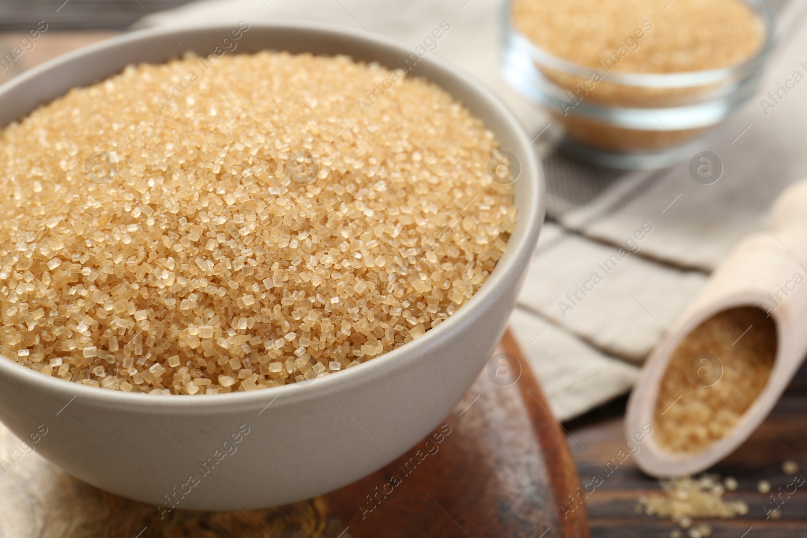 Brown sugar in bowl on table, closeup Photo of Brown sugar in bowl on table, closeup