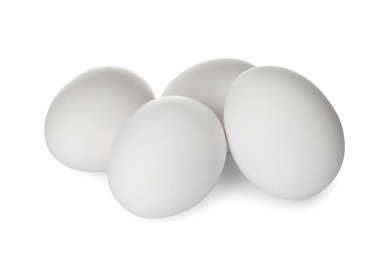 Photo of Few raw chicken eggs on white background
