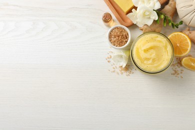 Photo of Flat lay composition with body scrub on white wooden background, space for text