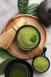 Photo of Flat lay composition with green matcha powder on white wooden table