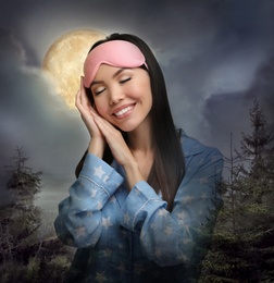 Image of Beautiful woman and night starry sky with full moon on background. Bedtime