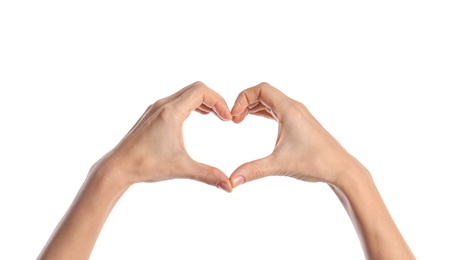 Photo of Woman making heart with her hands on white background, closeup