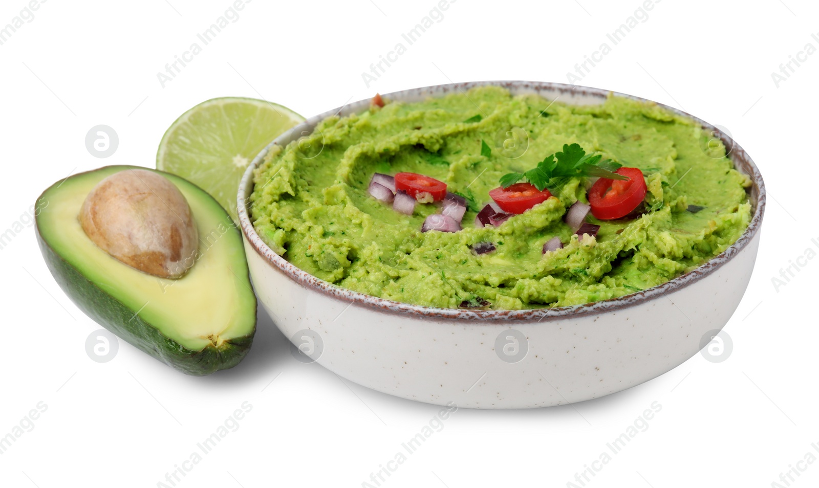 Photo of Bowl of delicious guacamole, fresh avocados and lime isolated on white