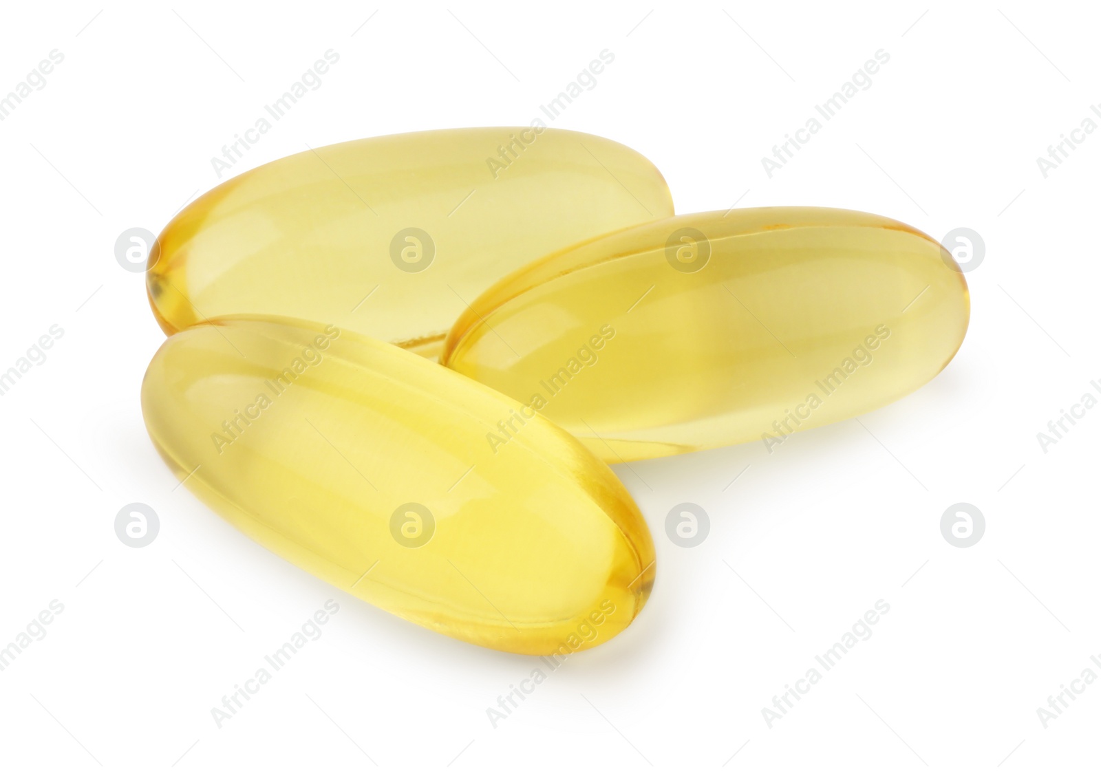 Photo of Many yellow vitamin capsules isolated on white