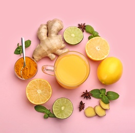Flat lay composition with immunity boosting drink and ingredients on pink background