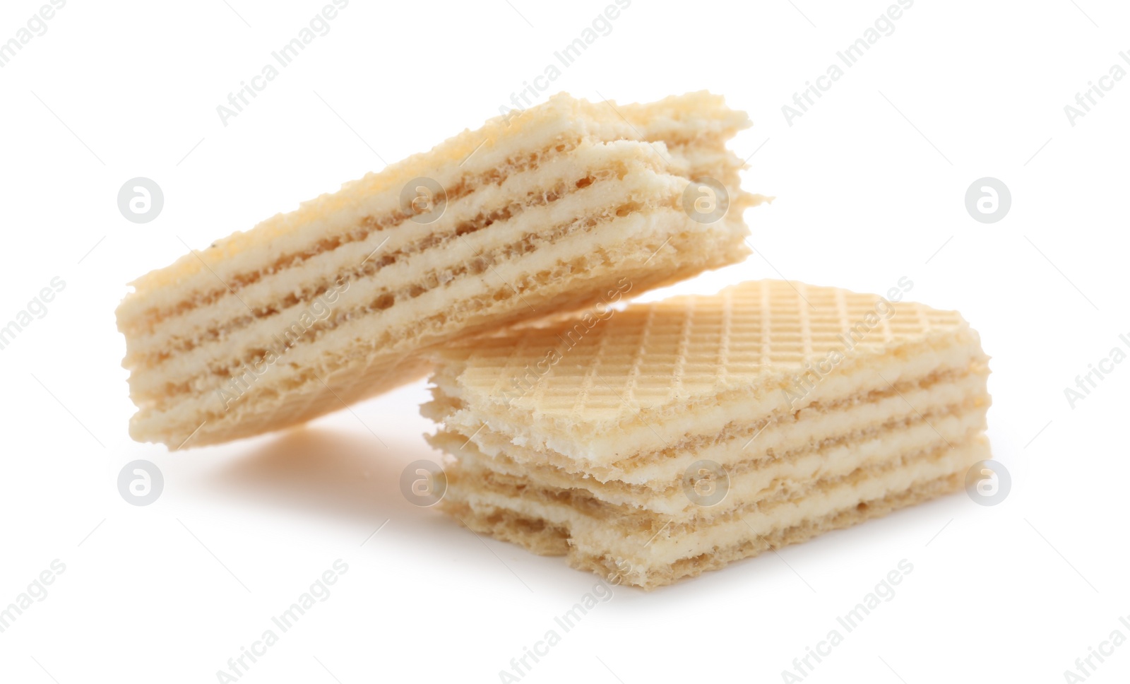 Photo of Delicious broken crispy wafer on white background. Sweet food