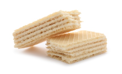 Photo of Delicious broken crispy wafer on white background. Sweet food