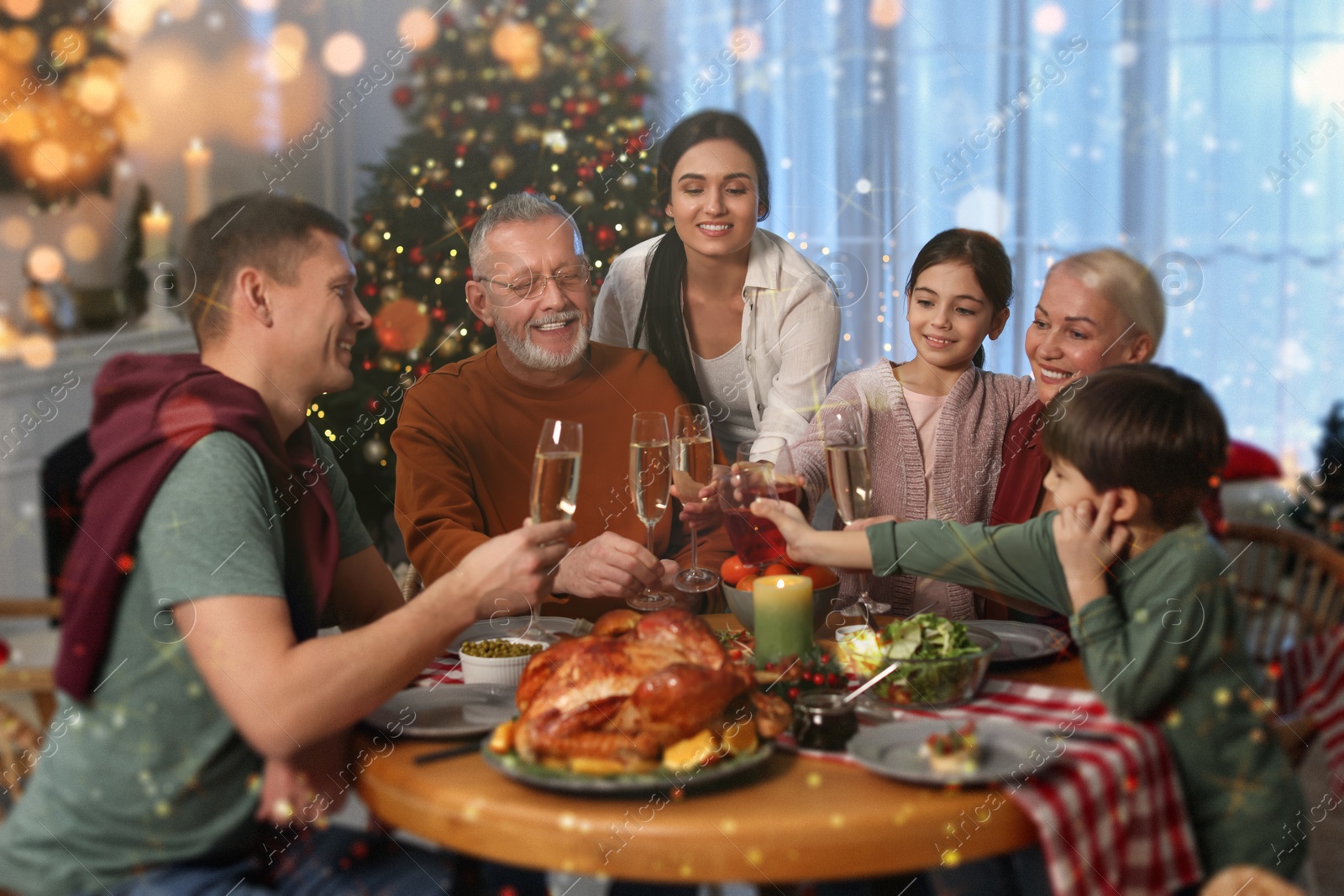 Image of Happy family clinking glasses at festive dinner indoors. Christmas celebration