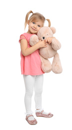 Photo of Cute little girl with teddy bear on white background