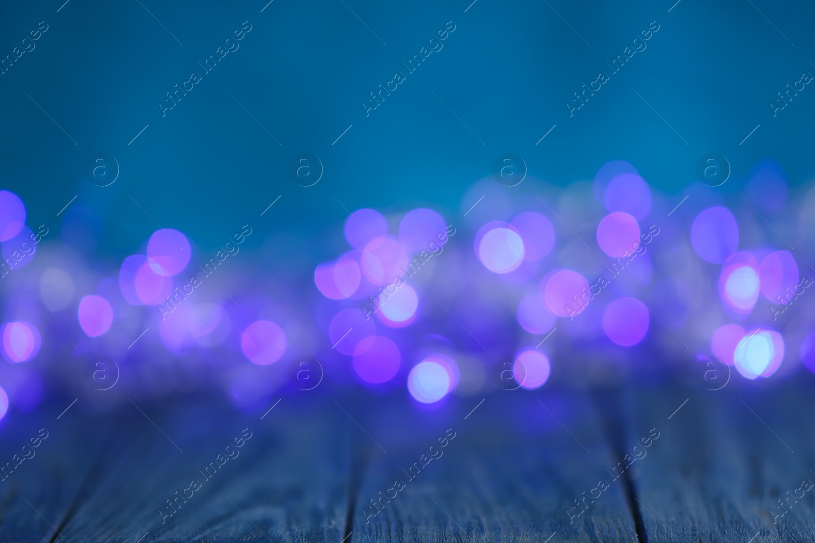 Photo of Beautiful abstract background with blurred violet Christmas lights