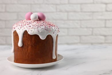 Tasty Easter cake on white marble table. Space for text