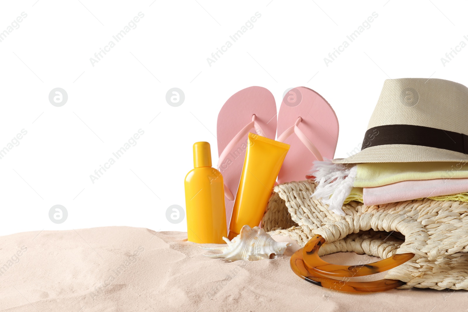 Photo of Composition with beach objects on sand against white background. Space for text