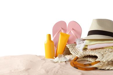 Photo of Composition with beach objects on sand against white background. Space for text