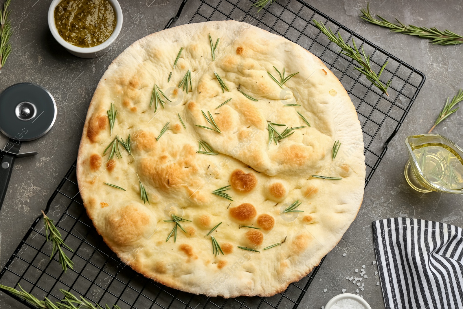 Photo of Flat lay composition with focaccia bread on grey table