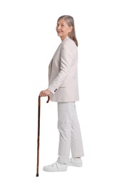 Senior woman with walking cane on white background