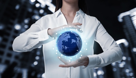 Image of Business analytics. Woman demonstrating virtual image of globe with network connection outdoors, closeup