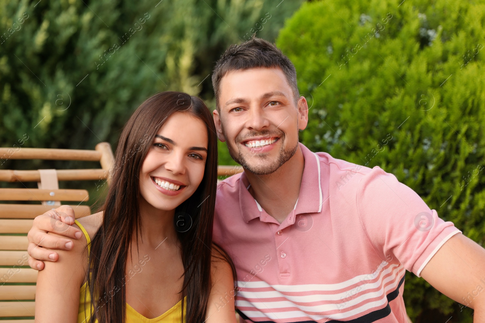 Image of Portrait of happy couple resting together outdoors