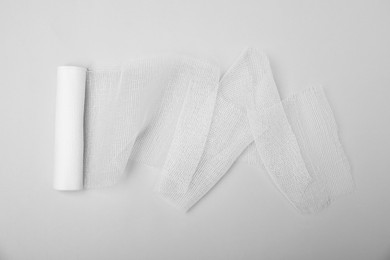 Photo of Medical bandage on white background, top view