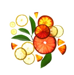 Photo of Illuminated slices of citrus fruits and leaves on white background, top view