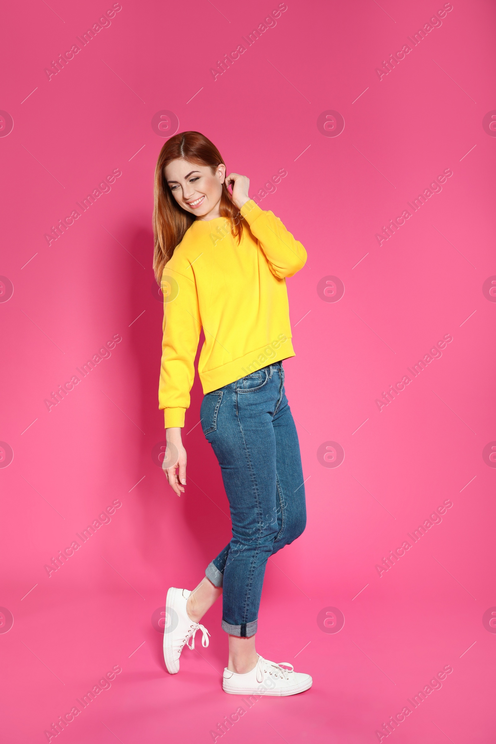 Photo of Full length portrait of beautiful woman on color background