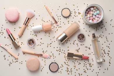 Photo of Flat lay composition with decorative cosmetics on color background