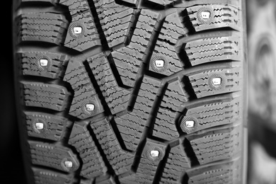 Car tire in auto store, closeup view