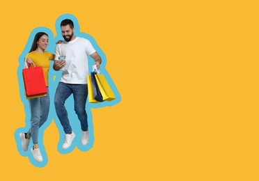 Image of Happy couple with shopping bags looking at smartphone and jumping on orange background, space for text