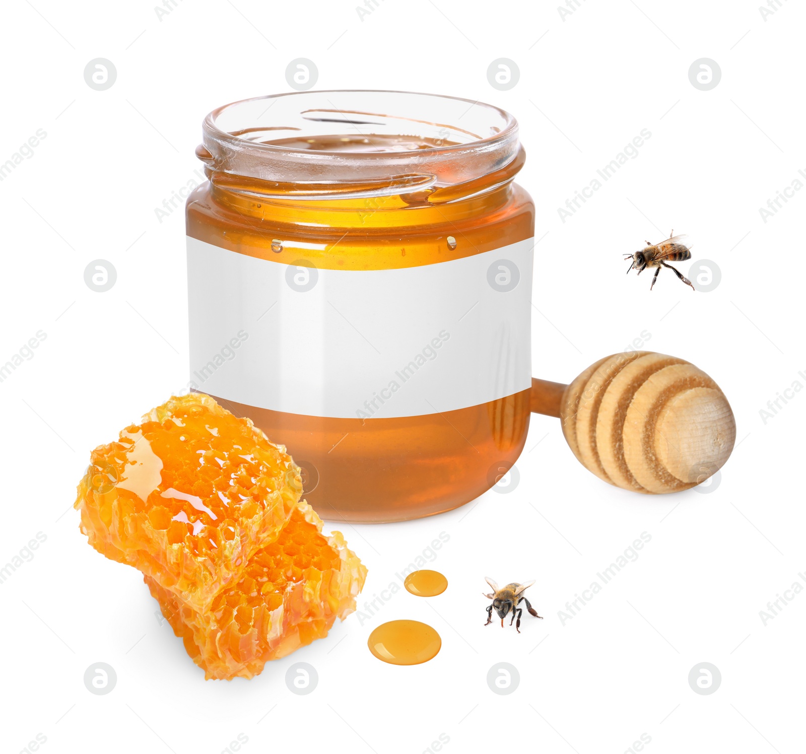 Image of Sweet honey in glass jar with blank label, honey dipper, pieces of honeycomb and flying bees on white background. Mockup for design