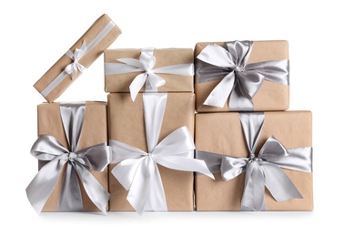 Photo of Beautifully wrapped gift boxes on white background