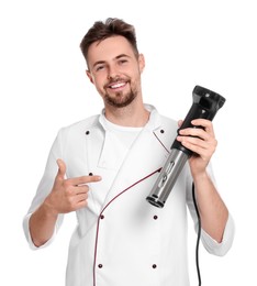 Photo of Smiling chef pointing on sous vide cooker against white background