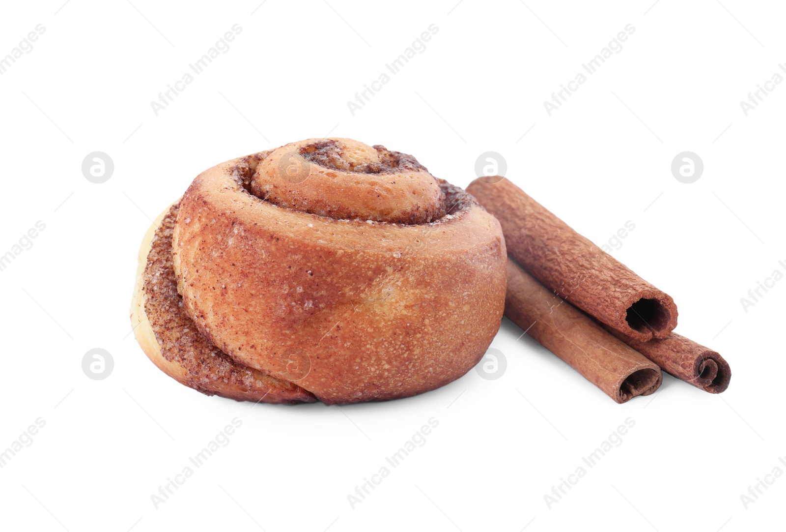 Photo of One tasty cinnamon roll and sticks isolated on white