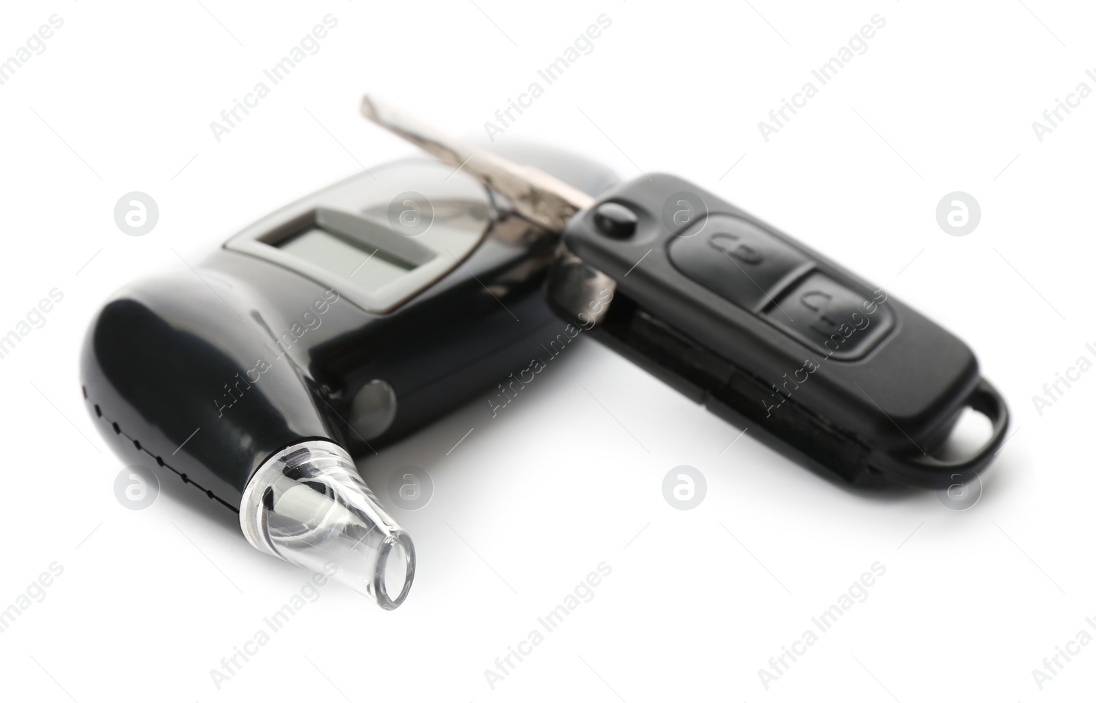 Photo of Modern breathalyzer and car key on white background